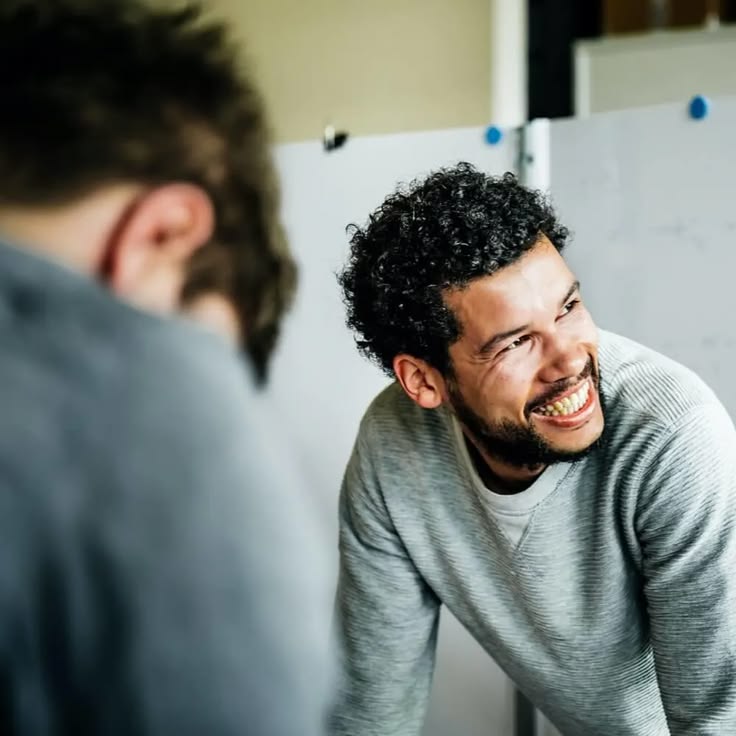 Smiling lending specialist talking with a business owner